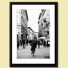 Photo of a girl in Florence, Italy riding a bicycle near piazza della repubblica by Photographer Scott Allen Wilson.