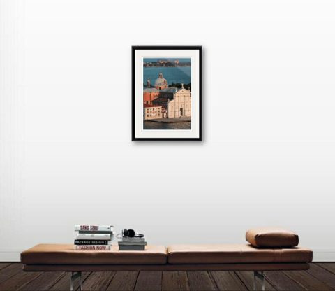A photo of two priests walking side-by-side in front of a venetian building in Venice, Italy. Artistic framed photograph taken by Photographer Scott Allen Wilson