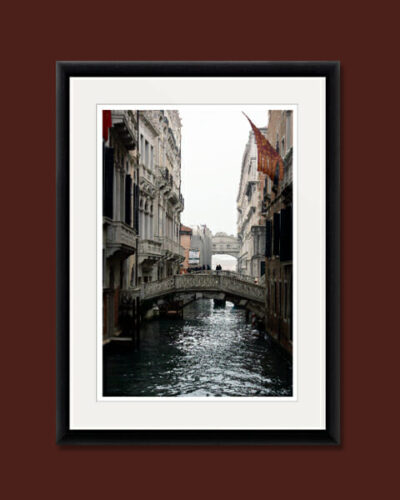 Beautiful photo taken in Venice, Italy by Photographer Scott Allen Wilson, of a narrow waterway and its bridges.