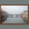 A framed print of Ponte Santa Trinita in Florence, Italy taken in the midst of a dense fog by Photographer Scott Allen Wilson.