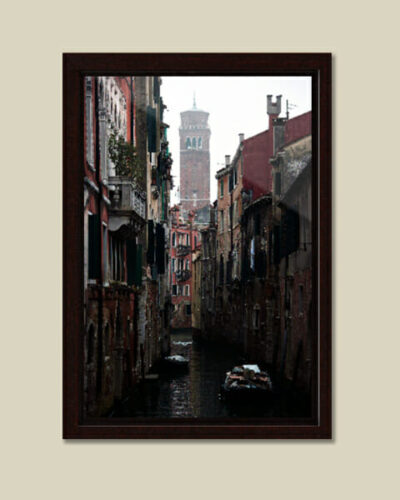 Calming framed photo of a waterway in Venice, Italy, taken by Photographer Scott Allen Wilson, with the Bell Tower of Santo Stefano standing in the background.