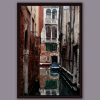 Relaxing photo of a corner in Venice, Italy, taken by Photographer Scott Allen Wilson, with a perfect mirror in the water.