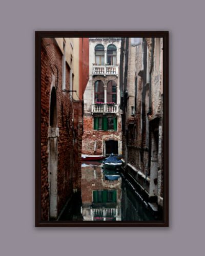 Relaxing photo of a corner in Venice, Italy, taken by Photographer Scott Allen Wilson, with a perfect mirror in the water.