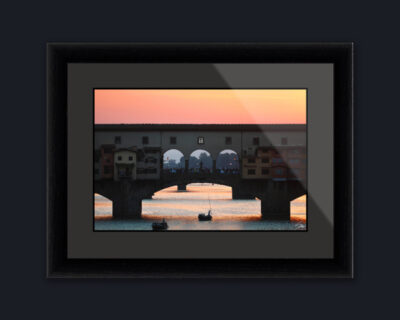 Ebony wood framed print of a sunset over Ponte Vecchio in Florence, Italy. Created by Photographer Scott Allen Wilson.