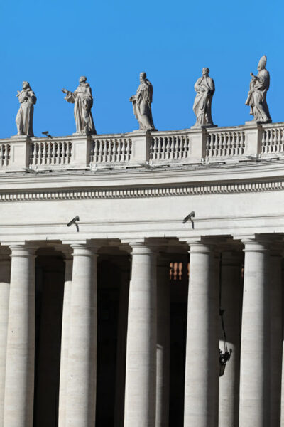 Picture of symmetric columns and gargoyles of St. Peter’s Basilica taken by Photographer Scott Allen Wilson in Rome, Italy.