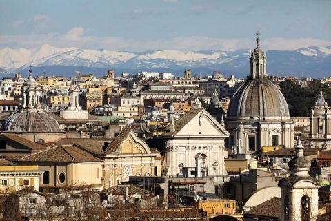 Amazing view of Rome, Italy with snowy mountains in the background taken by Photographer Scott Allen Wilson