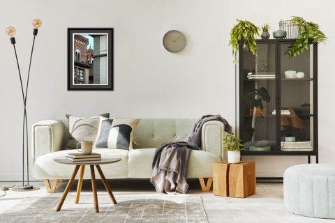 Green modern and cozy living room decoration with gray framed print of Palazzo Vecchio in Florence Italy by Photographer Scott Allen Wilson.