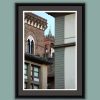 Color framed photo taken of tower of Palazzo Vecchio between buildings in Piazza della Repubblica by Photographer Scott Allen Wilson.