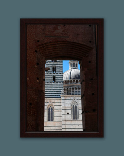 Artistic framed print of the Cathedral of Siena, Italy, peaking out behind a brick arch taken by Photographer Scott Allen Wilson.