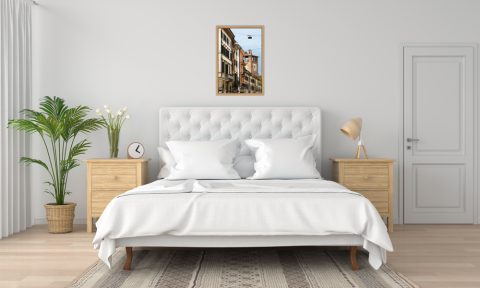 White bedroom decoration with a beautiful color print of a colorful street taken in Verona, Italy by Photographer Scott Allen Wilson.