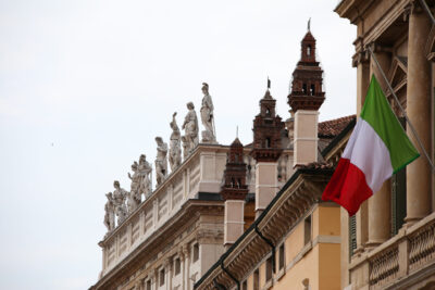 Architecture photo of Verona, Italy with statues and the Italian flag taken by Photographer Scott Allen Wilson