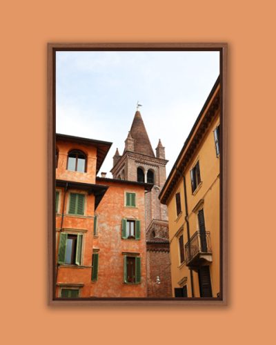 Artistic framed photo of Campanile of San Tommaso standing out between colorful buildings in Verona, Italy taken by Photographer Scott Allen Wilson