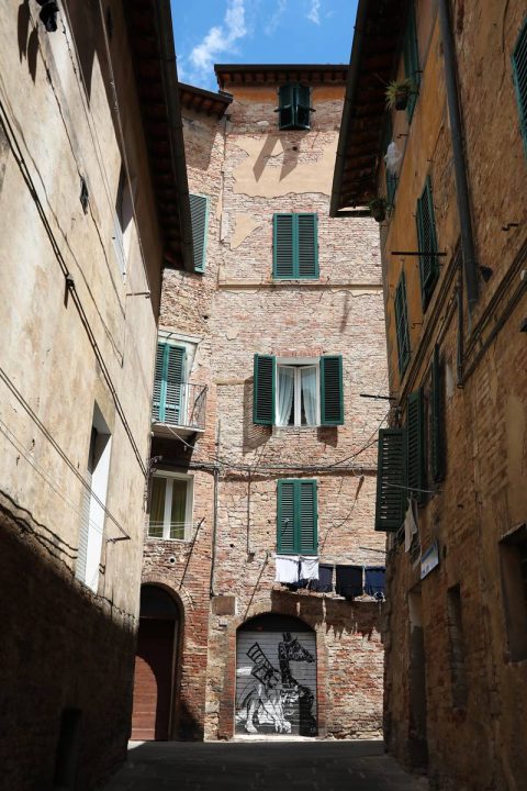 A beautiful medieval street in Siena, Italy taken by Photographer Scott Allen Wilson