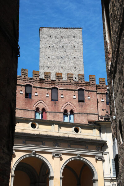 Beautiful mixture of stone, brick, and concrete walls that compose the façade of the Duomo Di Siena, Italy taken by Photographer Scott Allen Wilson.