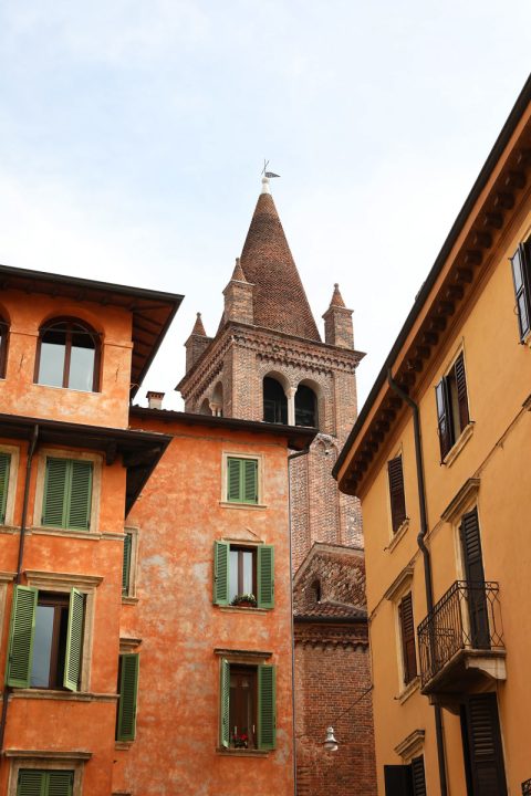 Artistic photo of Campanile of San Tommaso standing out between colorful buildings in Verona, Italy taken by Photographer Scott Allen Wilson