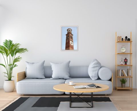 Light blue livingroom decoration with a white wooden framed print of the clocktower, Torre de Lamberti, in Verona, Italy taken by Photographer Scott Allen Wilson.