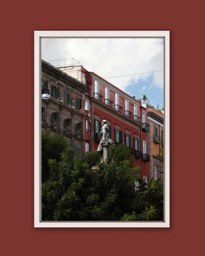 Elegant white framed print of the colorful buildings behind the bushes of Piazza Bellini located in Naples, Italy taken by Photographer Scott Allen Wilson