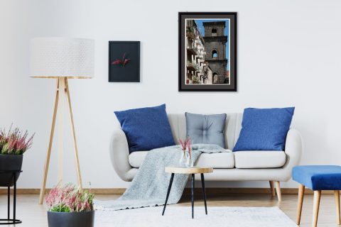 White living room decoration with blue cushions that combine with the sky of the print of Naples, Italy, taken by Photographer Scott Allen Wilson