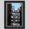 Framed print captured by Photographer Scott Allen Wilson of a residential building framed by a narrow street in Naples, Italy.