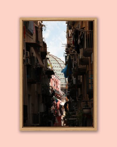 Framed photo of the dome of Galleria Umberto I between a narrow street in Naples, Italy taken by Photographer Scott Allen Wilson