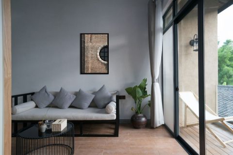 Modern gray living room decoration with a minimalist framed print of San Gregorio church located in Venice, Italy taken by Photographer Scott Allen Wilson