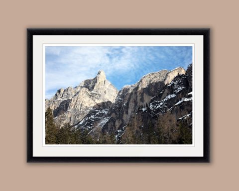 Close shot of the rocky mountain peaks in the Dolomites, Italy with pine trees at the bottom taken by Photographer Scott Allen Wilson.