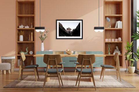 Cozy dining room decoration with a framed print of mountain peaks in the Dolomites, Italytaken by Photographer Scott Allen Wilson.