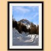 Portrait framed photo of a snow path leading to a snow-capped mountain of the Dolomites, Italy taken by Photographer Scott Allen Wilson.