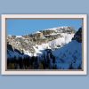 An amazing print of a jagged mountain of the Dolomites, Italy covered in snow and with a light blue sky in the background taken by Photographer Scott Allen Wilson.