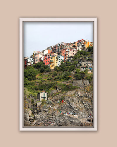 White framed artistic print of Corniglia in Cinque Terre, Italy. Captured by Photographer Scott Allen Wilson.