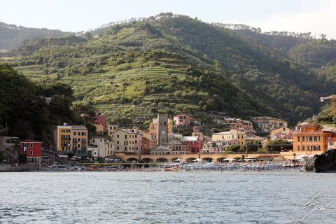 The vineyards contrast with the colorful buildings on the beach of Monterosso al Mare, Italy. By Photographer Scott Allen Wilson.