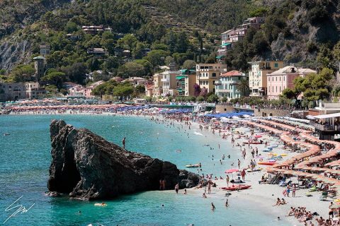 View of Monterosso al Mare in Cinque Terre, Italy. Colorful houses dot the hills overlooking the sea. By Photographer Scott Allen Wilson.