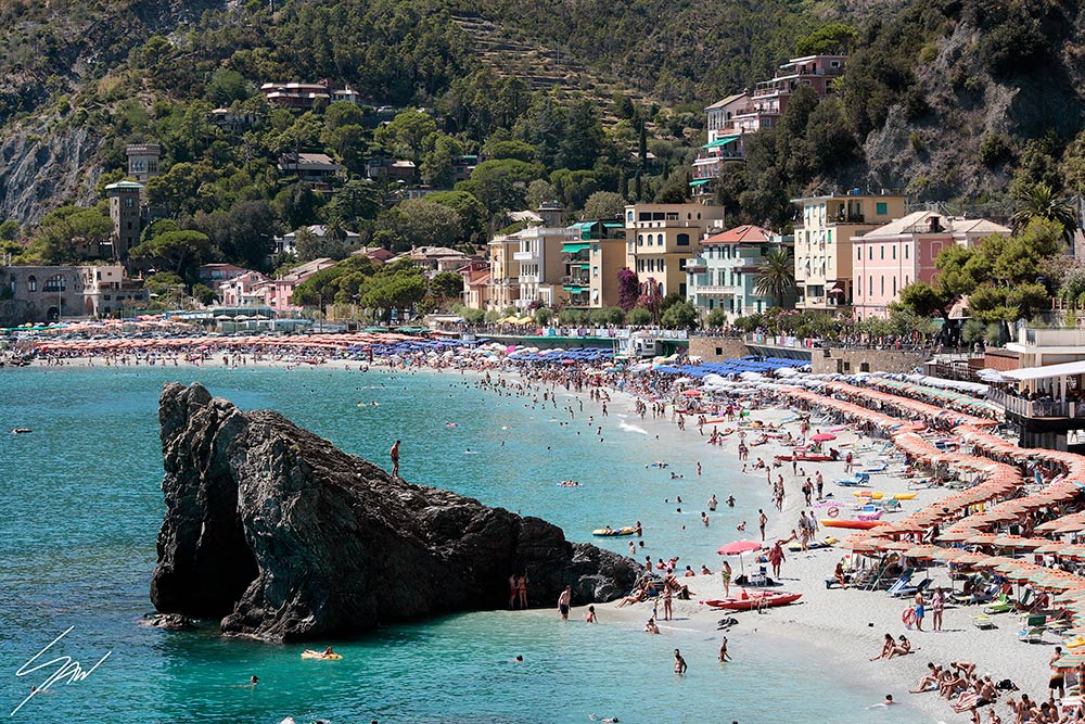View of Monterosso al Mare in Cinque Terre, Italy. Colorful houses dot the hills overlooking the sea. By Photographer Scott Allen Wilson.
