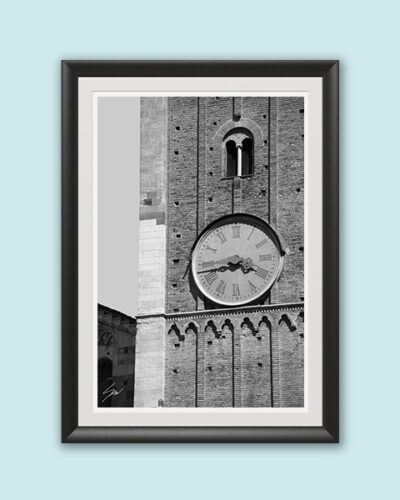 Black framed black and white print of a detail of the clock tower of Palazzo del Governatore. Captured by Scott Allen Wilson
