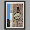 Black framed print of a detail of the clock tower of Palazzo del Governatore. Captured by Scott Allen Wilson