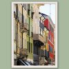 White framed print of colorful buildings in Parma. Created by Photographer Scott Allen Wilson