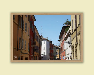 A view of the colorful buildings in Parma's streets. By Photographer Scott Allen Wilson