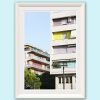 A white framed print of colorful buildings in Pescara, Italy. By Photographer Scott Allen Wilson.