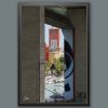 A black framed print of a square with a clock tower in Pescara, Italy. By Photographer Scott Allen Wilson.