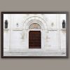 A brown framed print of the San Cetteo Cathedral in Pescara, Italy. Captured by Photographer Scott Allen Wilson.
