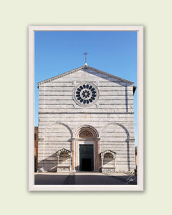 A white framed print of the façade of San Francesco Church in Lucca, Italy, with a rose window. By Photographer Scott Allen Wilson.