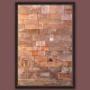 A dark brown framed print of a red brick wall in the city of Lucca, Italy. By Photographer Scott Allen Wilson.
