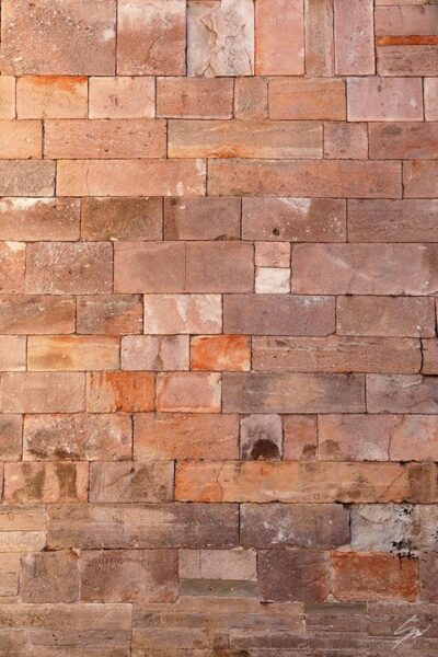 Red brick wall in the city of Lucca, Italy. By Photographer Scott Allen Wilson.