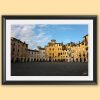 A black framed print of piazza dell’anfiteatro in the city of Lucca, Italy. By Photographer Scott Allen Wilson.
