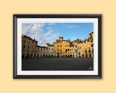 A black framed print of piazza dell’anfiteatro in the city of Lucca, Italy. By Photographer Scott Allen Wilson.