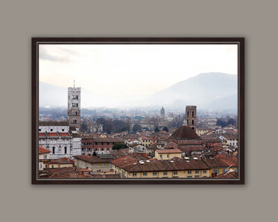 A dark brown framed print of the city of Lucca, Italy. By Photographer Scott Allen Wilson.