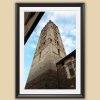 A black framed print of a brick tower in the city of Lucca, Italy. By Photographer Scott Allen Wilson.