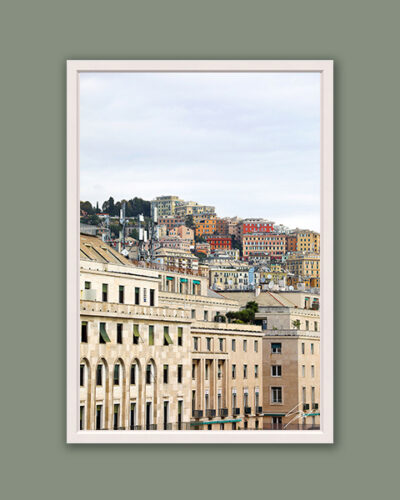 White framed artistic print of a gorgeous scenery in Genova, Italy, showcasing the vivid palette of gradient housing on a hillside. Photo captured by Travel Photographer Scott Allen Wilson.