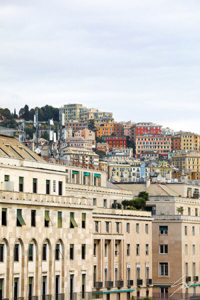 A colorful cascade of residential buildings in the port city of Genova. Photo captured by Travel Photographer Scott Allen Wilson.