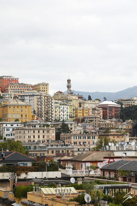 Vibrant array of residences form a gorgeous mosaic against the Genovese grey sky. Photo captured by Travel Photographer Scott Allen Wilson.